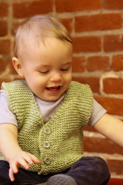 Easy to knit garter stitch baby vest. Free baby vest knit pattern.