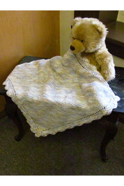 garter stitch baby blanket with crochet border. Free baby knit pattern.