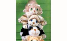 Four knitted cats – tabby, ginger, black-and-white and moggy knit patterns