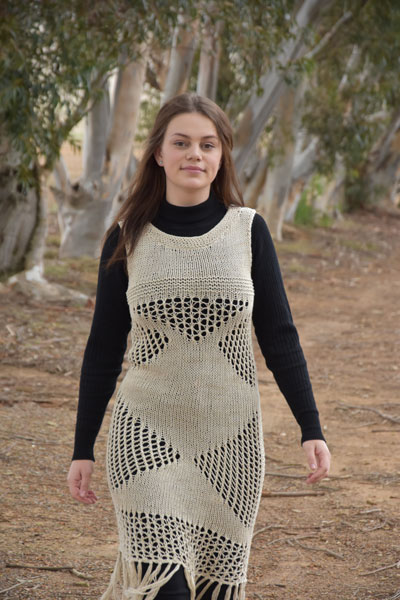 Lacy Dress Free Knitting Pattern. Stunning lacy fitted dress knitting pattern with eyelets and fringing.