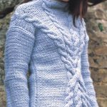 Free knitting pattern for a high necked sweater with criss cross cables in the front, this sweater will keep you super warm with the use of chunky weight yarn.