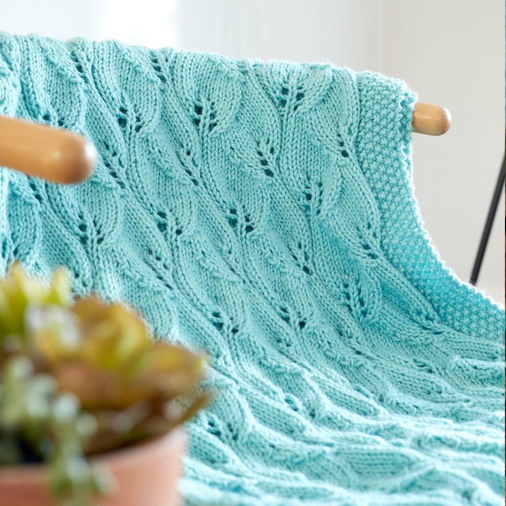 Free Knitting Pattern for a Leafy Lace Green Afghan.