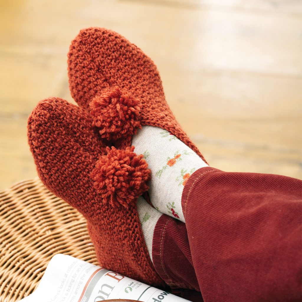 Free knitting pattern for textured slippers with pom pom