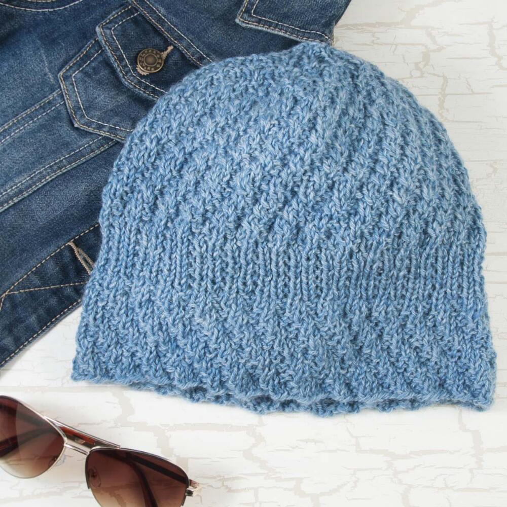 Casual yet chic, this textured hat with a denim look is perfect for chilly fall days. Free hat knitting pattern