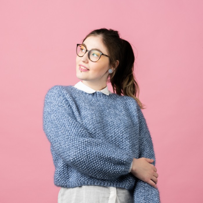 Free knitting pattern for a cute ladies sweater in seed stitch with a ribbed round neckline