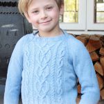 Knitted sweater for kids with raglan and cables free pattern
