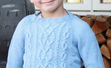 Knitted sweater for kids with raglan and cables free pattern
