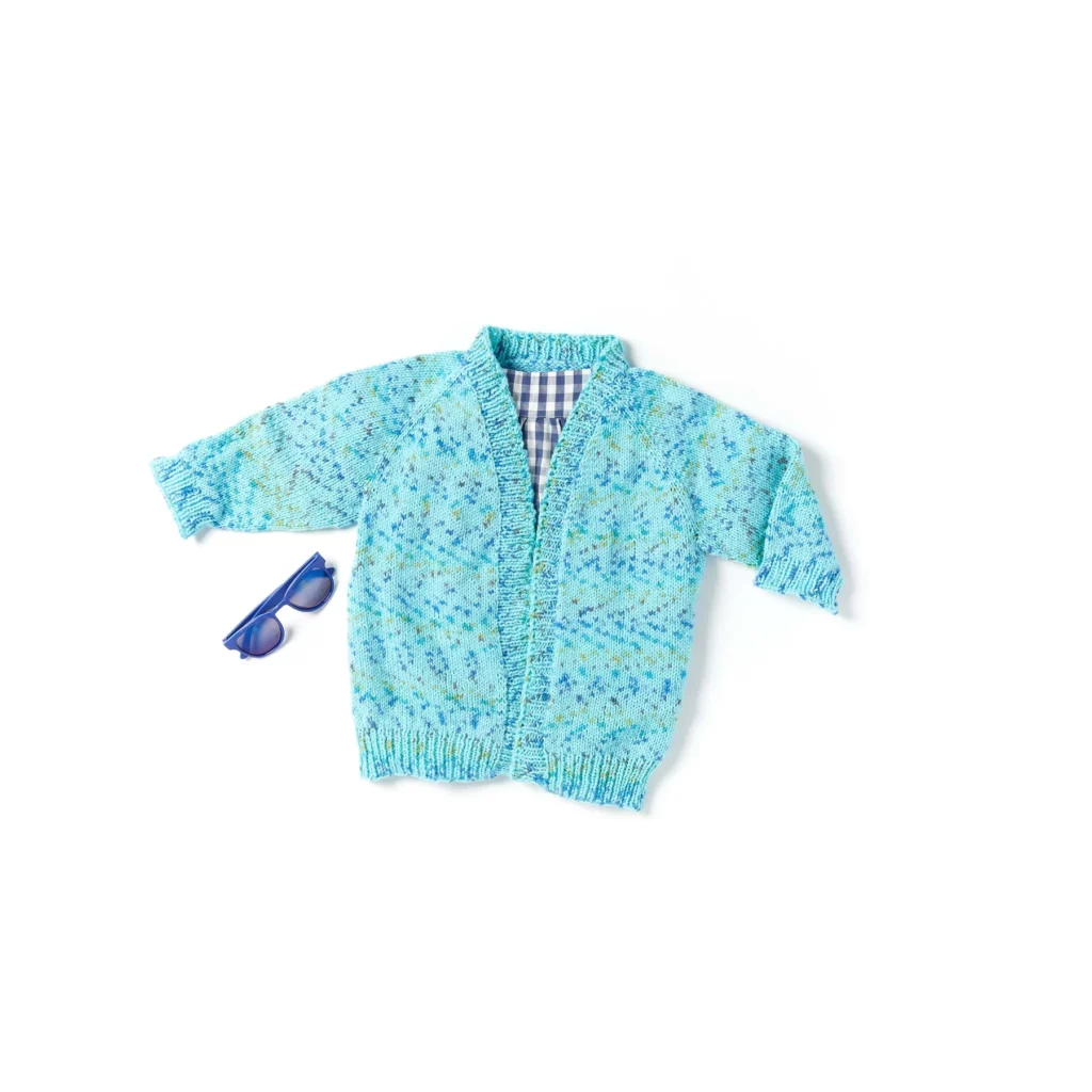 a blue yarn baby jacket that is knit