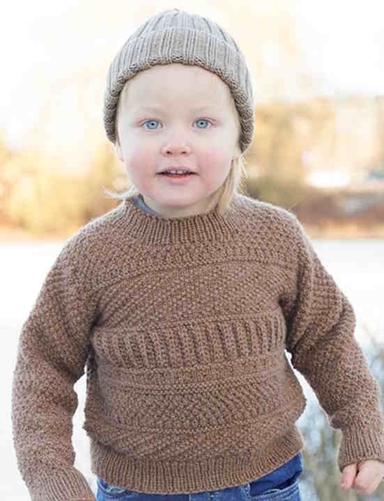 boy in a brown textured sweater and hat