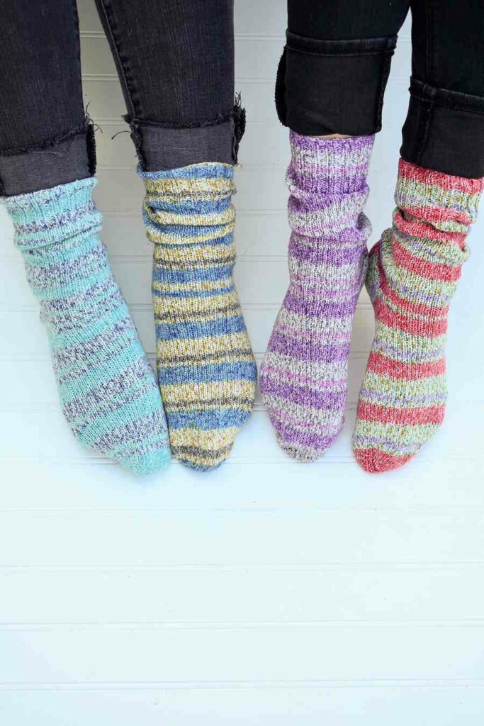 A simple, top-down view of a basic toe-up sock knit in a smooth, solid-colored bamboo blend yarn, featuring a 2x2 ribbed cuff and a seamless stockinette foot.