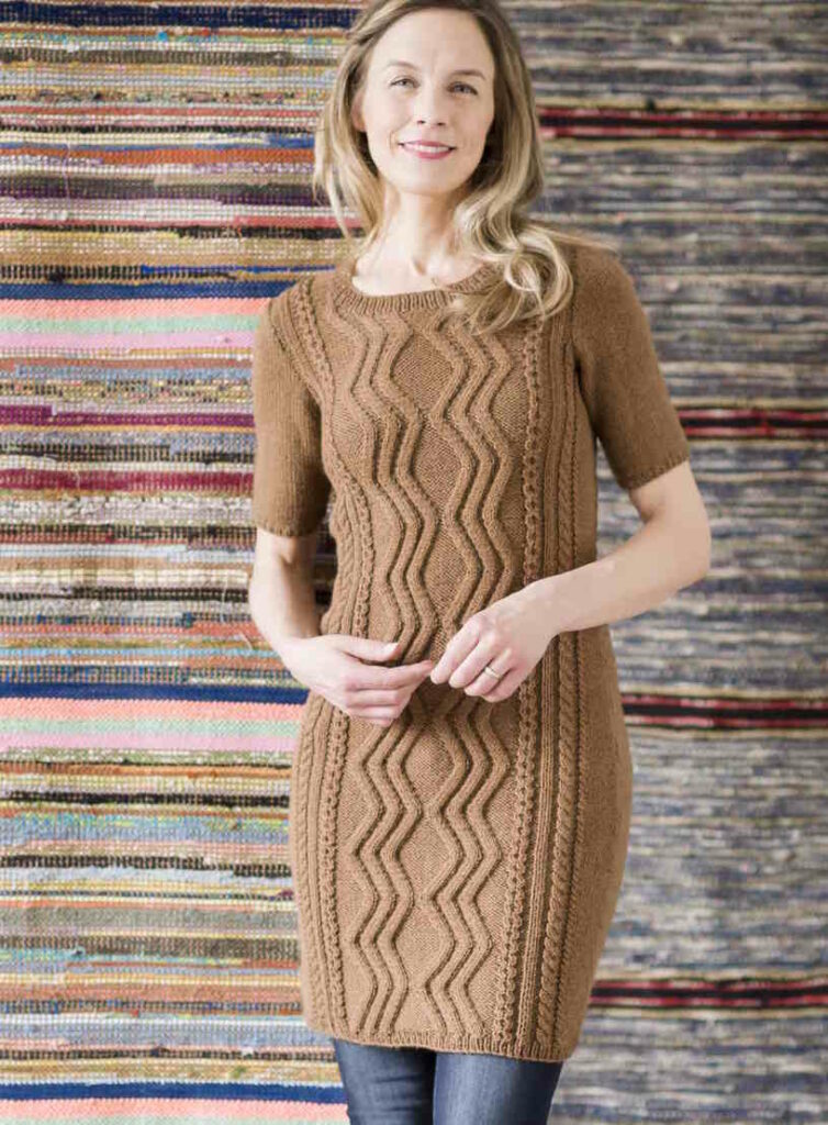 Milk chocolate short sleeve dress with central cable panel.