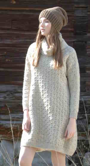 Sand colored long sleeve dress with allover cable stitch patternand warm cowl neckline.