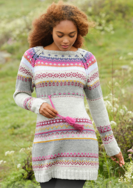 Multi-colored knit dress with a yoke pattern, raglan sleeves, and a cinched waist tie.
