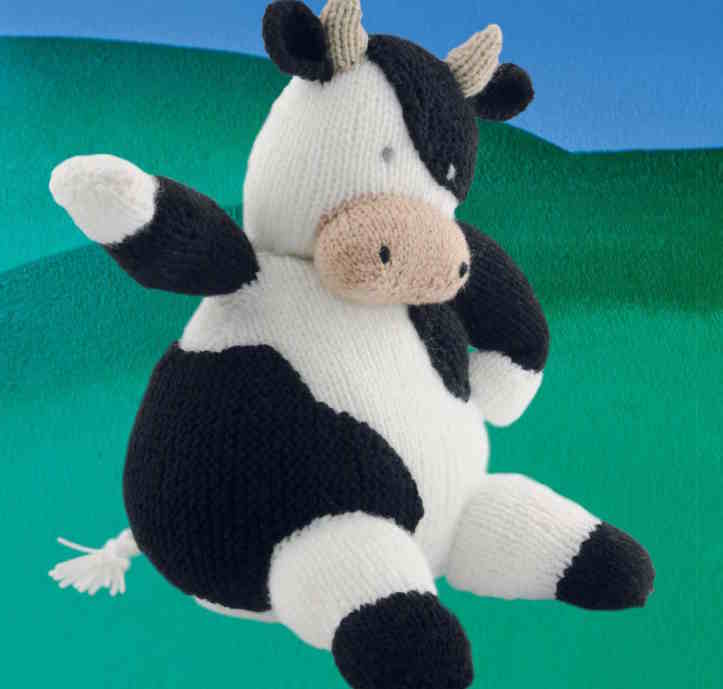 black and white kitted plush cow